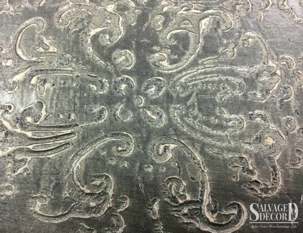 Repairing a damaged top with a textured finish using a decorative art roller and embossing medium.